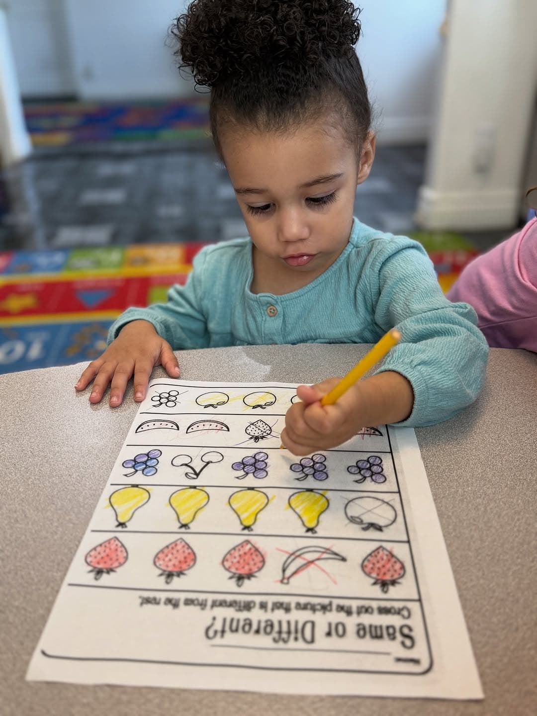 Child completing a coloring activity